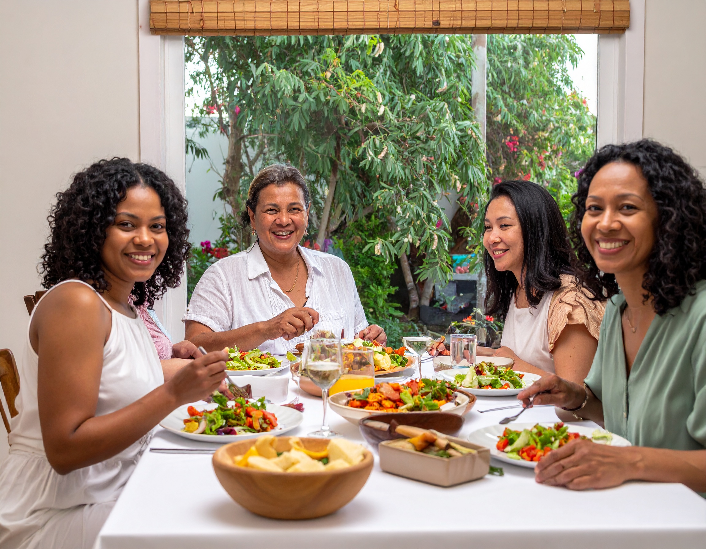 A group of women are enjoying a meal together.