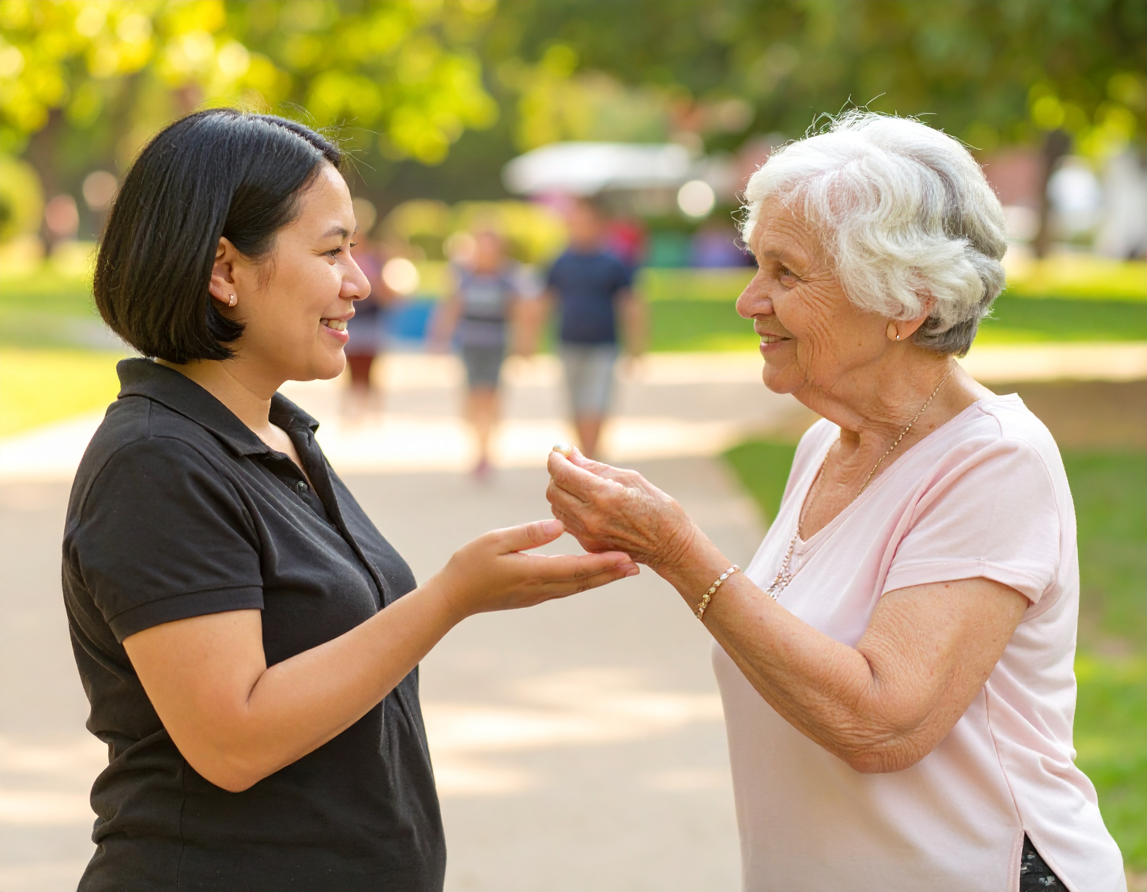 One woman handing a pearl to another woman.
